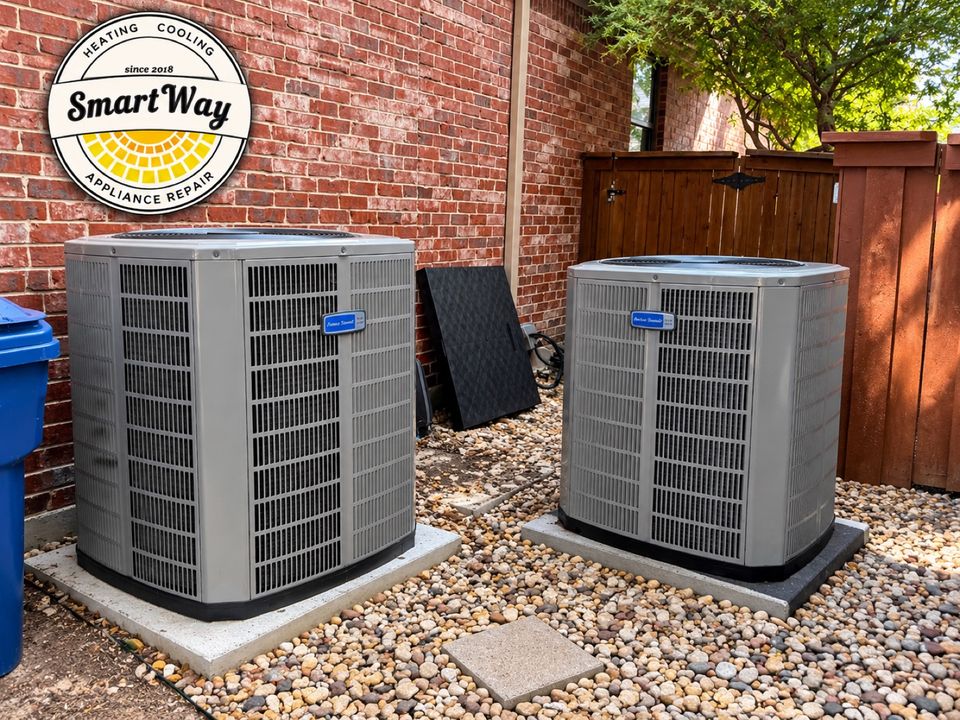 Two newly replaced outdoor AC condenser units sitting side by side